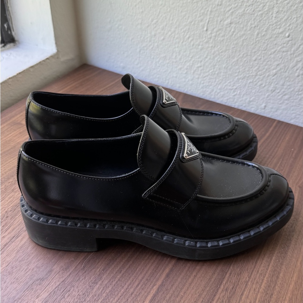 Prada loafers.